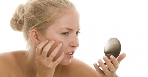 Woman looking at mirror