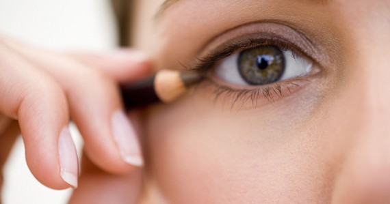 Woman applying eyeliner