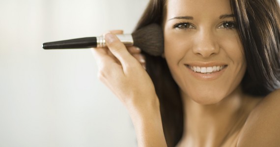 Woman applying makeup